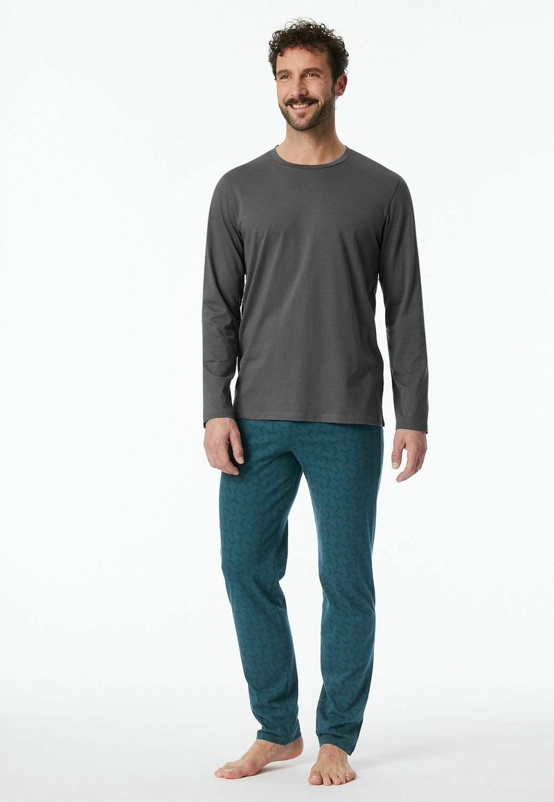 Gray long-sleeve shirt and teal patterned pants made of soft fabric. The pants feature a subtle swirling design and an elastic waistband.
