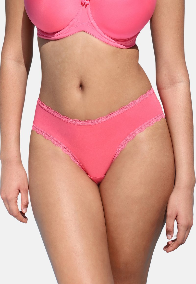 Bright pink multi-part underwear features a smooth, stretchy main fabric and decorative lace trim along the waistband and leg openings.