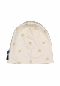 Kermakuvioinen pipo pehmeästä kankaasta, jossa on hajallaan vaaleanruskeita sydänkuvioita, ommeltu pää ja pieni merkki sivulla.