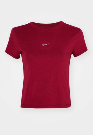 Červené bavlnené tričko s krátkymi rukávmi, okrúhlym výstrihom a malým bielym logom Nike na hrudi. Hladká textúra, priliehavý strih.
