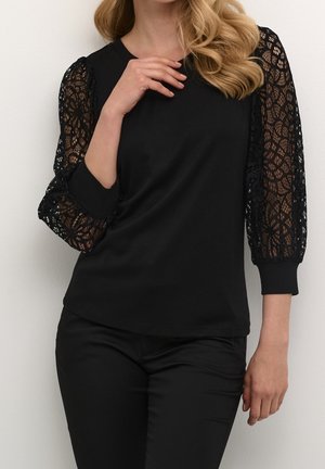 Bluse - mottled black