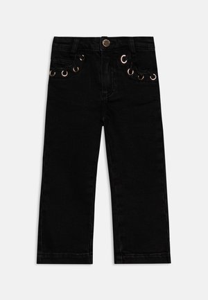 Jeans a sigaretta in denim nero con vita aderente, caratterizzati da dettagli con occhielli dorati e tasche frontali. Design classico a cinque tasche.