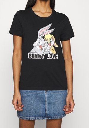Black cotton T-shirt featuring a cartoon graphic of a rabbit and a female character with text "Bunny Love" in bold white font.