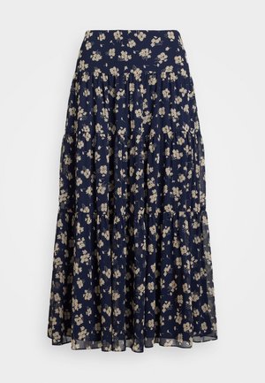 Navy blue floral maxi skirt featuring a tiered design, soft fabric, and beige flower patterns throughout. Elastic waistband for comfort.