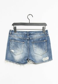 Farkkutrikoot, vaaleansiniset, joissa on risat helmanteet, kaksi takataskua ja kulutustekstuuri, esitelty mustalla ripustimella.