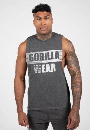Grijze mouwloze shirt met een gedurfde "GORILLA WEAR" grafiek in wit en zwart. Zachte stof, ontspannen pasvorm, ideaal voor atletische activiteiten.