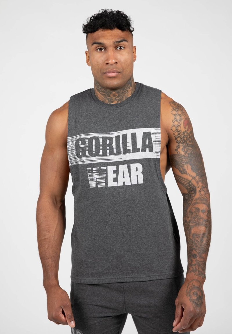 Grijze mouwloze shirt met een gedurfde "GORILLA WEAR" grafiek in wit en zwart. Zachte stof, ontspannen pasvorm, ideaal voor atletische activiteiten.