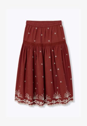Jupe couleur rouille longueur genou avec motifs floraux brodés blancs et ourlet en dentelle festonné, dotée d'une ceinture élastique et de tissu froncé.