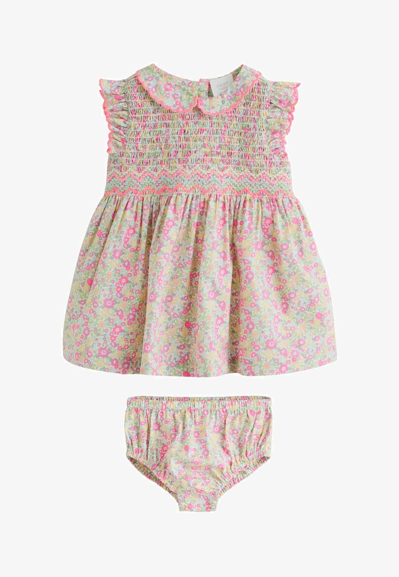 Florales Kleid und passendes Höschen-Set aus weicher Baumwolle. Heller Hintergrund mit kleinen rosa und grünen Blumen. Mit Raffung am Oberteil und gerafften Ärmeln.