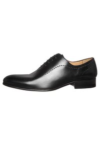 Chaussure Oxford en cuir noir avec un bout effilé élégant, des détails finement cousus et un talon bas et arrondi. Texture lisse dans l'ensemble.