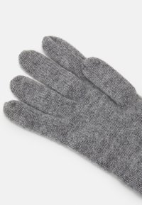 Gray knitted gloves with a soft texture, featuring individual finger slots and a simple design. No patterns or distinct accents present.
