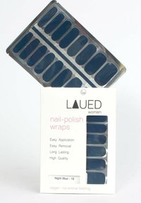Nail polish wraps in night blue, featuring a glossy finish. Packaged with easy application instructions. Includes 16 strips. Vegan, cruelty-free.