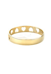 Gold bangle with cut-out heart shapes along the band, featuring a smooth surface and a polished finish, showcasing minimalist design.