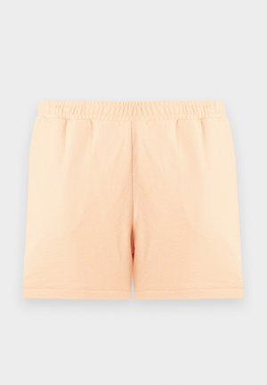 Σορτς σε ανοιχτό ροδακινί χρώμα με ελαστική μέση, μεσαίου μήκους, λείο ύφασμα, επίπεδο μπροστινό μέρος, παρουσιασμένα σε απλό ανοιχτό φόντο.
