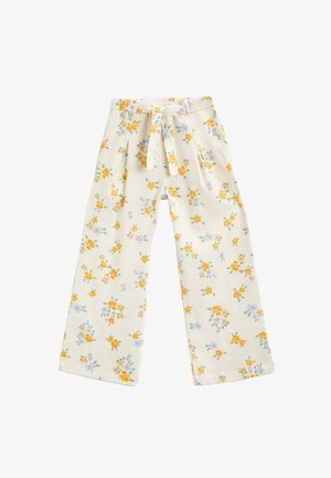 Kwiatowe spodnie z szerokimi nogawkami w białym kolorze z żółtymi i niebieskimi kwiatami. Posiadają wiązany pas i fałdy dla dodatkowego efektu.