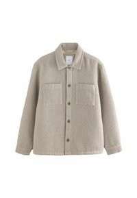 Textured beige overshirt with a collar, front pockets, and green buttons. Made from woven fabric with a grid pattern and long sleeves.