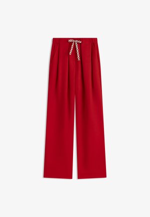 Red wide-leg trousers with elastic waistband and a patterned drawstring tie, laid flat on white background.