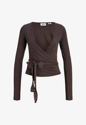 Ruda ilgomis rankovėmis glaudžiai prigludusi palaidinė su giliu V formos iškirpimu ir priekyje surišta juosta. Pagaminta iš lygaus, tampraus audinio.