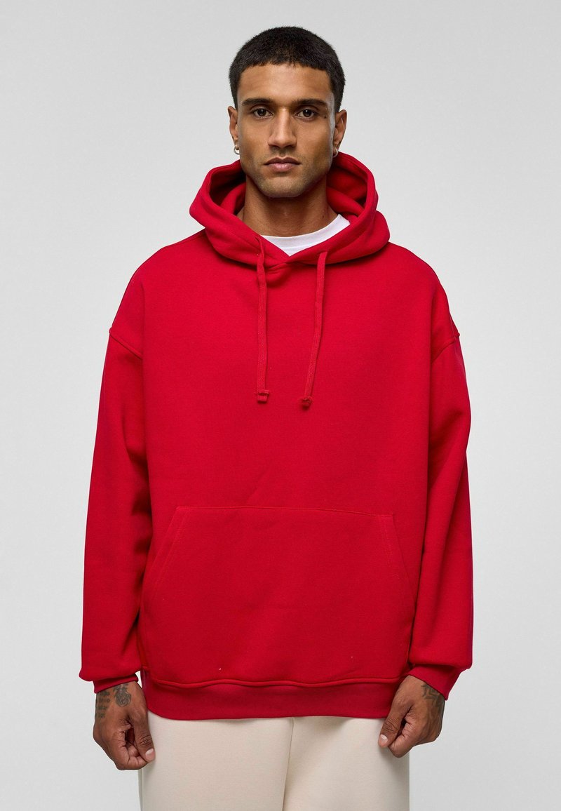 Rode pullover hoodie van een zachte katoenmix, met een voorzak, capuchon met trekkoord, brede mouwen en een relaxte pasvorm.