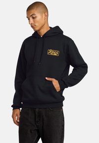 Black hoodie with yellow logo, drawstring hood, and front pocket. Long sleeves with ribbed cuffs, made from a soft cotton blend.