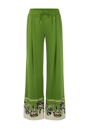 Grüne Hosen mit weitem Bein, elastischem Bund und Kordelzug, mit schwarzem und rotem Blumenmuster auf beigen Bündchen.