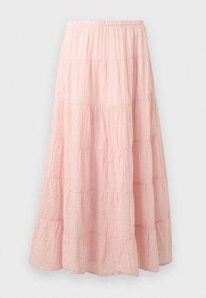Jupe longue à volants rose clair avec une ceinture élastique et une texture de tissu légèrement froissé.