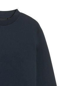 Navyblauwe sweatshirt met een ronde hals, gemaakt van zacht katoen. Eenvoudig ontwerp, met lange mouwen en een ontspannen pasvorm.