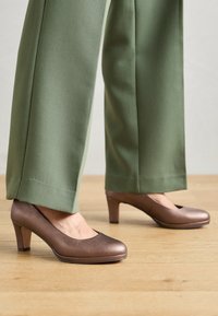 Sélectionné, bronce