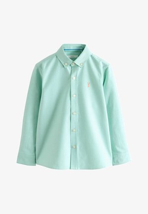 Chemise à manches longues vert clair avec boutonnage sur le devant, col boutonné et petit logo brodé couleur pêche sur la poitrine gauche.
