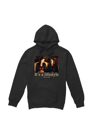 Black hoodie with a photo of two women sitting on a couch and text "It's a lifestyle Gilmore girls" on the front.