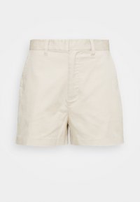 Shorts en coton beige taille haute avec passants de ceinture, poches latérales et fermeture dissimulée à l'avant, présentés sur un fond blanc.