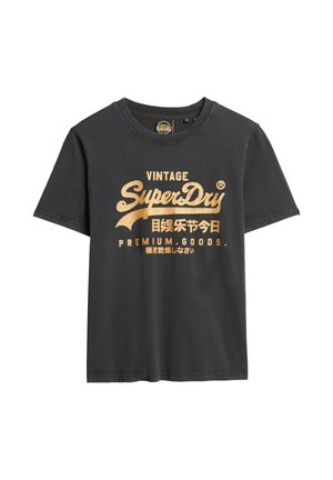 T-shirt noir à manches courtes avec texte doré « Vintage SuperDry Premium Goods » et caractères japonais imprimés sur le devant.