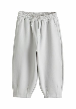 Lysegrå joggingbukser med elastisk talje og snøre, sidelommer og smalle ben på hvid baggrund.