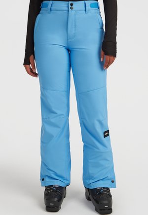 Blauwe sneeuwbroek van een glad, waterdicht materiaal, met een rechte snit, dubbele knopen aan de voorkant en een logopatch bij de enkel.