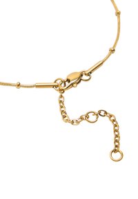 Bransoletka w odcieniu złota, z elastycznym łańcuchem, zapięciem typu lobster oraz regulowanym łańcuchem przedłużającym z okrągłymi ogniwami i małą pętelką.