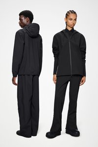 Black hooded jacket and pants made from lightweight material with a smooth texture; features a front zipper and elastic cuffs.