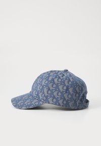 Blue baseball cap with a repeating lighter blue pattern. Features a curved brim and an adjustable back closure. Fabric appears textured.