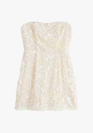 Krátke šaty bez ramienok v slonovinovej farbe s hustým pokrytím malých okrúhlych flitrov po celej látke.