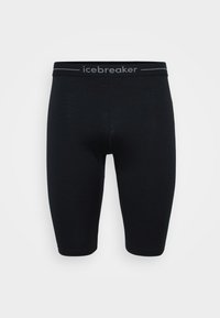 Leggings ajustados negros fabricados con un material suave, con una cintura cómoda que lleva el logo "icebreaker" en gris. Sin patrones ni acentos distintivos.