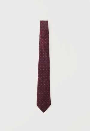 Dark red necktie with a subtle diamond pattern of small white and red dots laid flat on a light background.