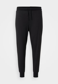 Pantalons de jogging noirs en tissu doux, dotés d'une taille élastique avec cordon de serrage, de chevilles resserrées et d'une surface lisse et sans embellissement.