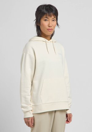 Hoodie van zacht crèmekleurig materiaal, met een voorzak, elastische manchetten en een subtiele logo op de borst. Glad textuur, losse pasvorm.