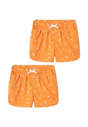 Orangene Shorts aus einem weichen Stoff, mit einem weißen Kordelzug und kleinen weißen Blumenmustern auf der Oberfläche.
