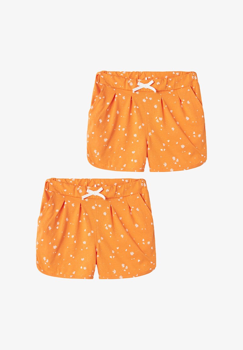 Orange shorts made of fabric with a soft texture, featuring a white drawstring and small white floral patterns across the surface.