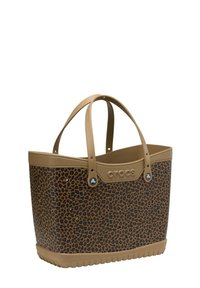 Torebka tote we wzór panterki, wykonana z trwałego brązowego gumowego materiału o gładkiej teksturze, z dwiema solidnymi uchwytami oraz tłoczonym logo.
