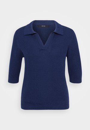 Pull en maille bleu marine avec un col en V et des manches courtes, présentant un col contrasté et un motif en relief texturé sur l'ensemble.