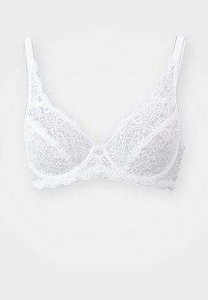 White lace bra featuring a floral pattern, underwire, and adjustable straps; scalloped edges and small button detail at the center.