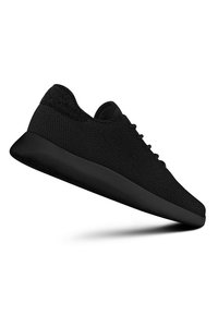 Black athletic shoes featuring a mesh upper, rounded toe, flat rubber sole, and lace-up design for a secure fit. Minimalist style throughout.