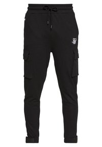 Zwarte joggingsbroek van zachte stof, met zijvakken, een elastische tailleband met trekkoord en ribgebreide boorden. Gevoegd borduursel zichtbaar.