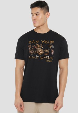Black cotton t-shirt featuring a graphic design with the text "SAY YOUR RIGHT WORDS!" and various character faces from "Labyrinth."